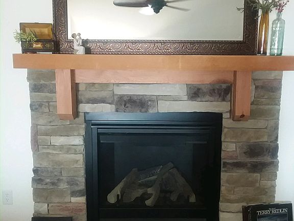 Fireplace with wood mantel