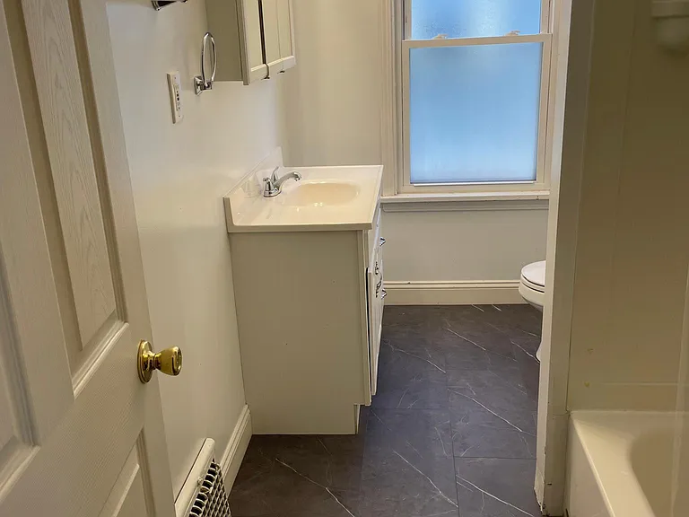 bath with updated flooring