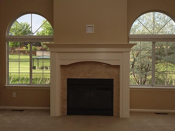 Living room with view of the park as you enjoy the gas fireplace.