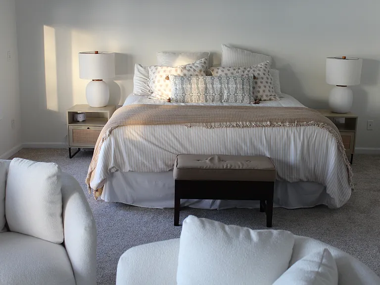 Master bedroom with king bed and sitting area