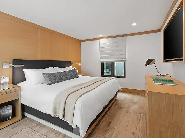 King sized bed fully outfitted with luxurious linens