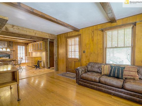Hardwood floors and cedar beams in the main living area.