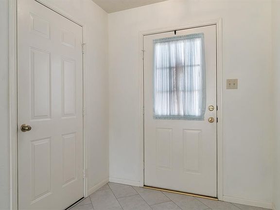 Foyer has been updated with grey tile floors. Entry into your garage is just off foyer. Garage has automatic garage opener and storage.