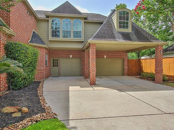 Large driveway and porte-cochere provide lots of parking.
