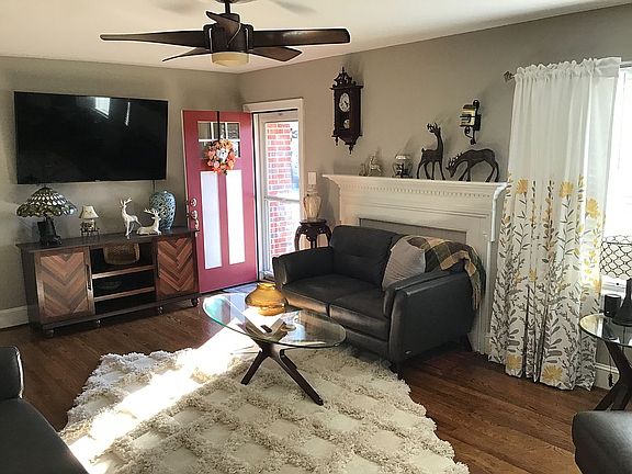 Formal living rm w/ wood fpl