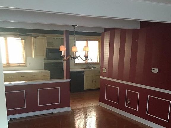 This rrom has been painted beige with white trim.