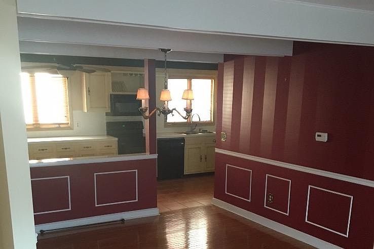 This rrom has been painted beige with white trim.