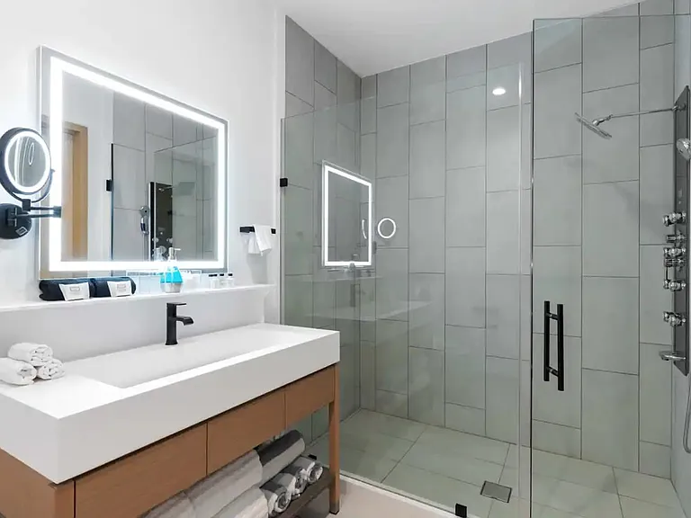 LED-lit vanity mirrors and spacious rain shower to leave you feeling refreshed
