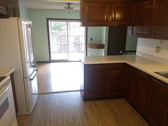 Nice kitchen, looking toward dining room and partially-covered back porch.