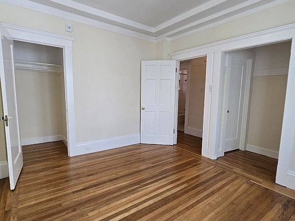 Bedroom with view of 2 closets