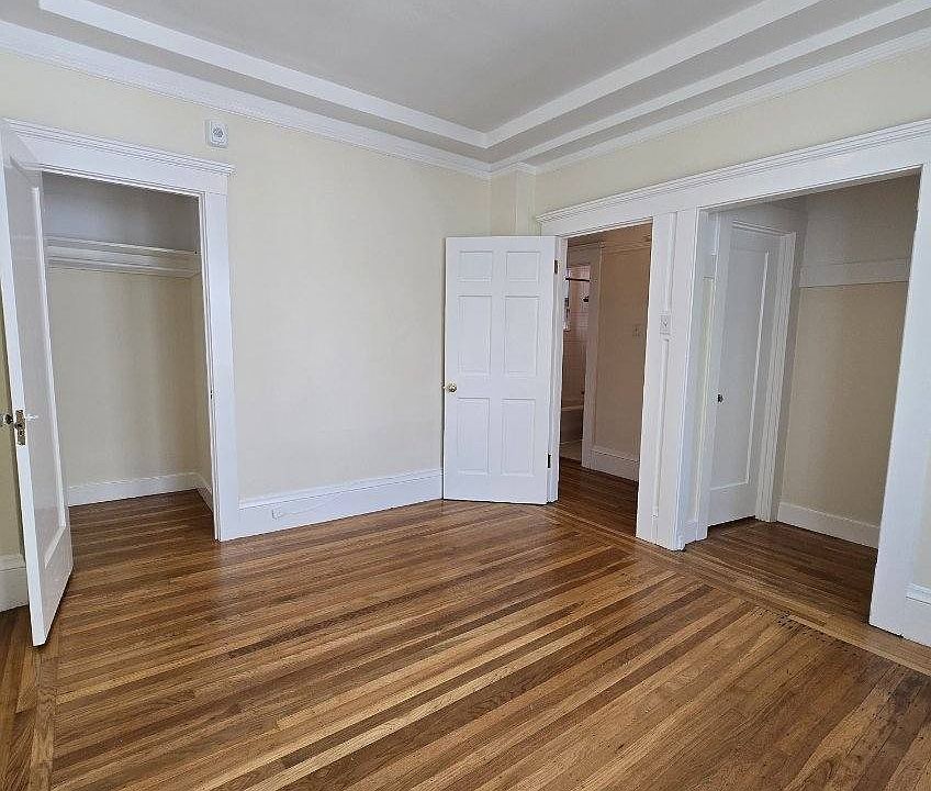 Bedroom with view of 2 closets