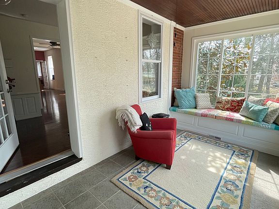 Sunny enclosed porch.