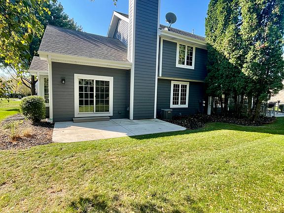 Rear yard with large concrete patio