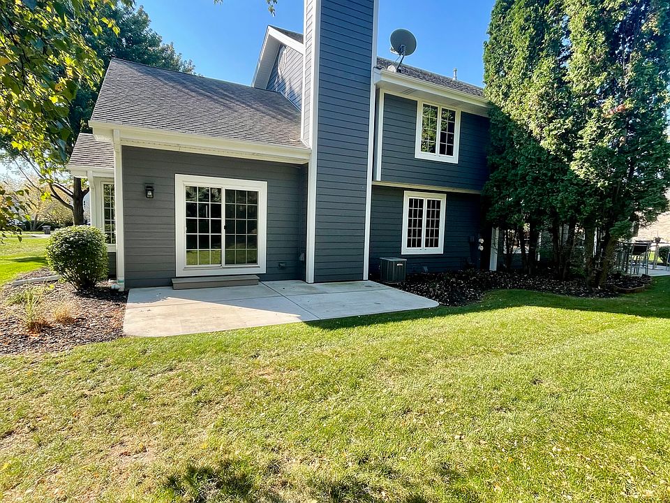 Rear yard with large concrete patio