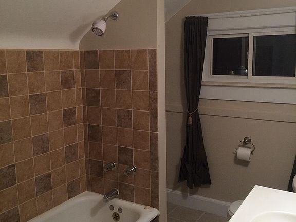 1 angle of bath. Door with large insulated storage area acc