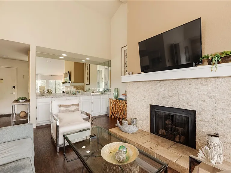 Beautiful gas fireplace travertine hearth with 55" smart TV with 400MPBS Xfinity wifi.