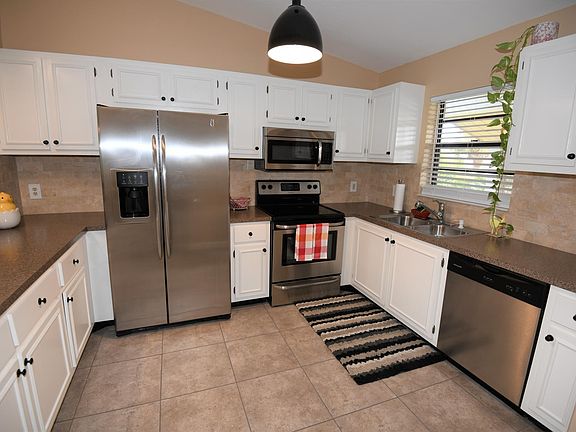 Large updated kitchen with new stainless steel appliances.  