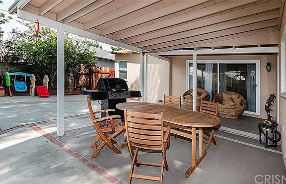 Rear covered patio with gas line for your BBQ.