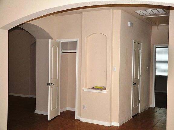 Facing the front of the house. Entry coat closet on the left.