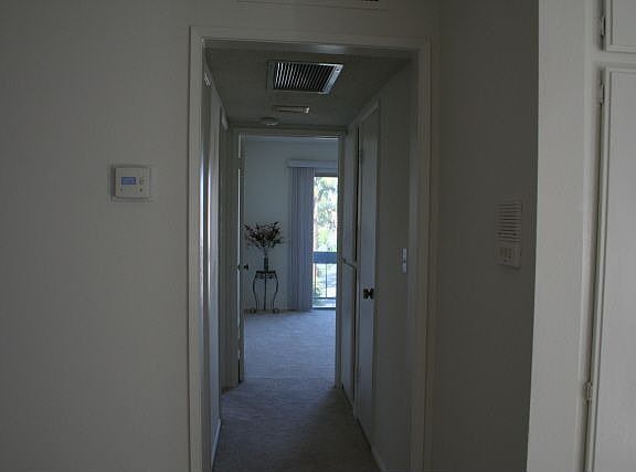 Hallway Between Bedrooms Facing Balcony