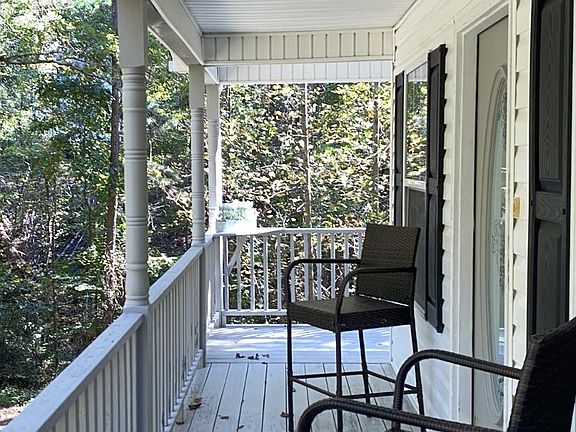 Full wrap around porch to sit and enjoy the views!!