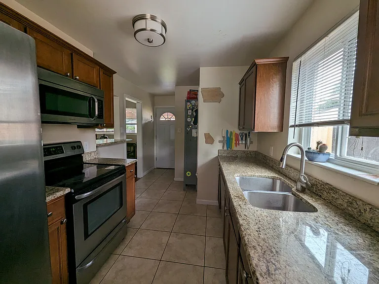 Granite countertops and Stainless steel appliances