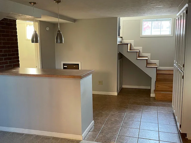 Finished basement includes living area, bar, min fridge, and bathroom. Utility room is located in the basement. Washer and dryer not included. Hook ups are available.
