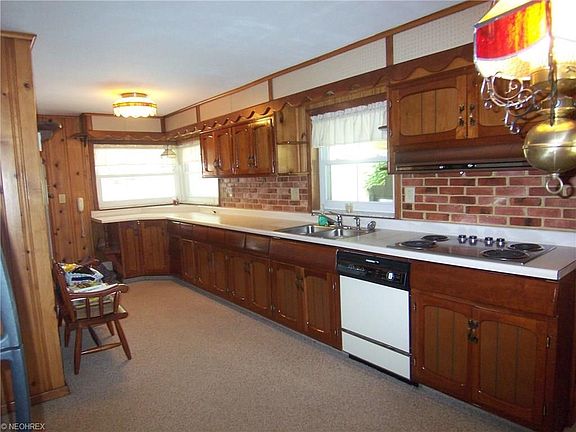 Galley style kitchen with older quality craftsman style cabinetry and tons of storage