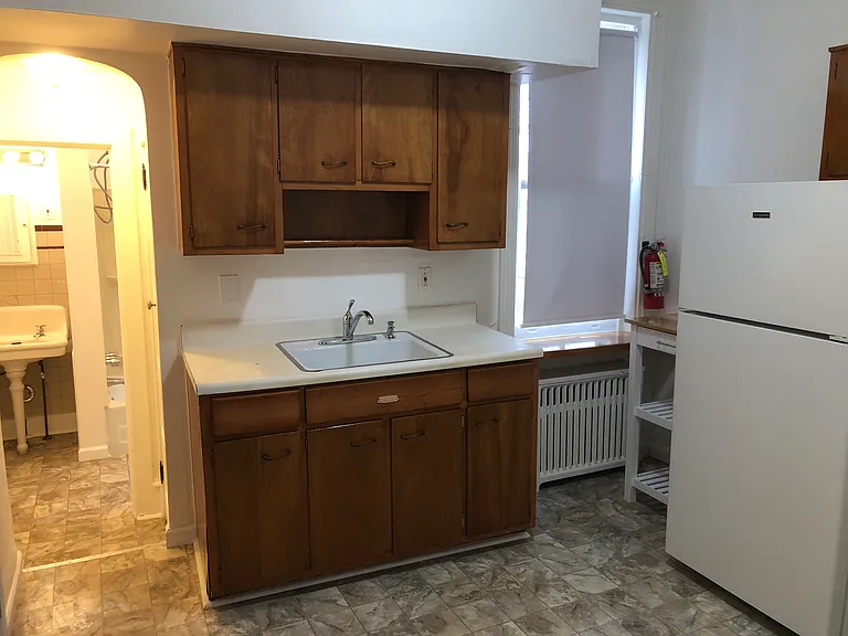 hallway leads to right side closet and bathroom