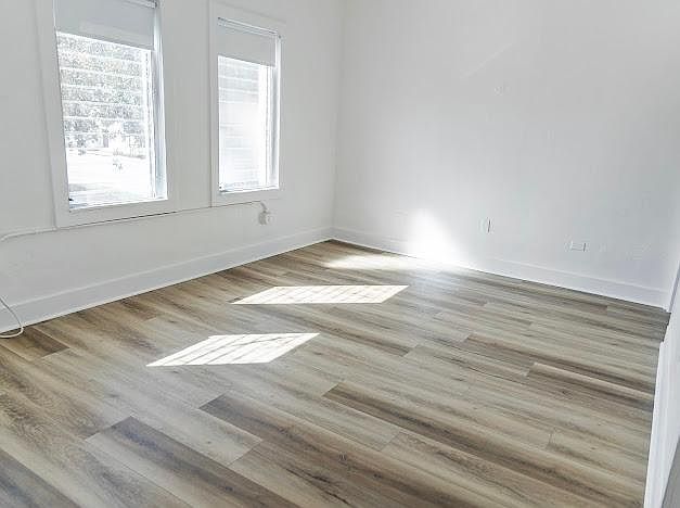 Spacious bedroom with windows overlooking downtown Miami Shores
