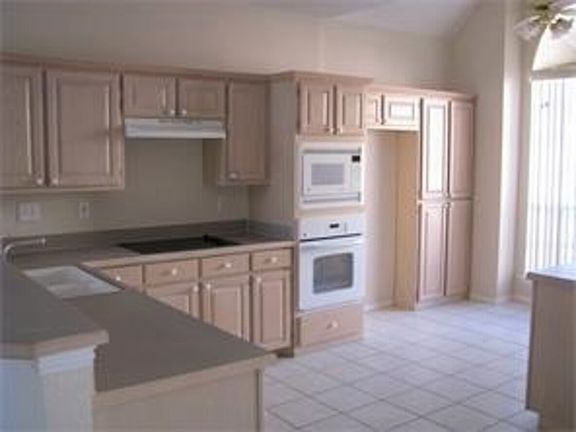 Bright kitchen with ample cabinets and good size breakfast area