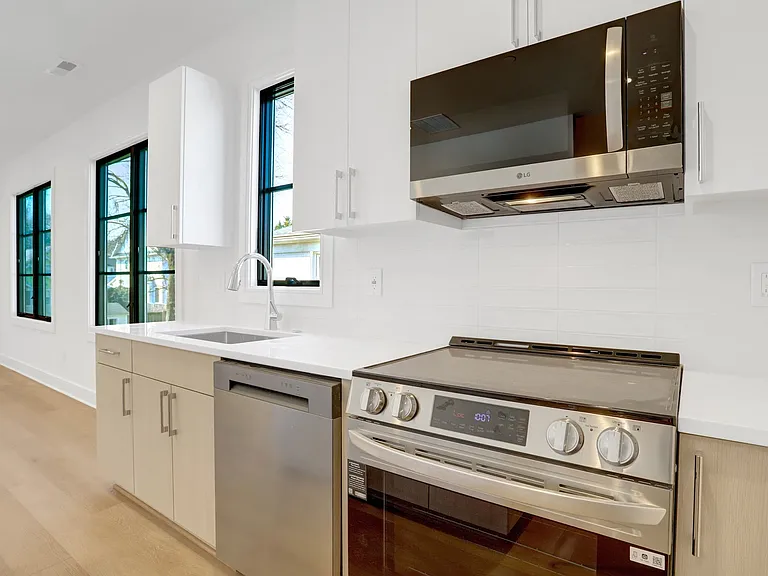 Kitchen with Quartz Countertops and Tile Backsplash