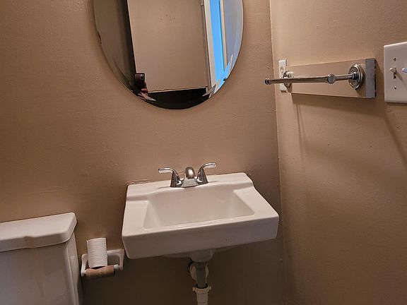 Downstairs bathroom with laundry hook-ups