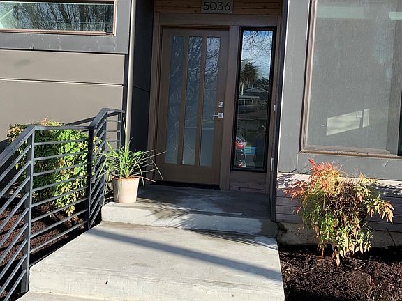 Welcoming front entrance with bedroom window to the right, bathroom window to the left.