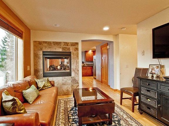 Double sided fireplace makes a great focal point and creates separation from the living room to the 