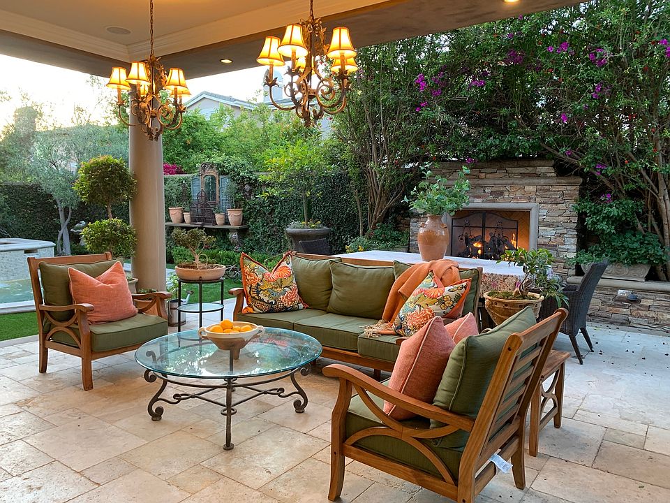Outdoor covered patio area with fireplace