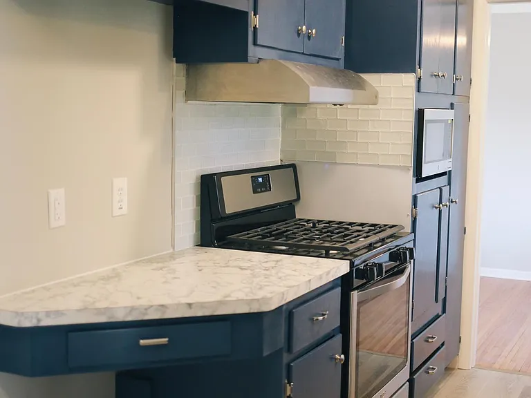 Appliances new in 2019, includes stove, microwave, and fridge.