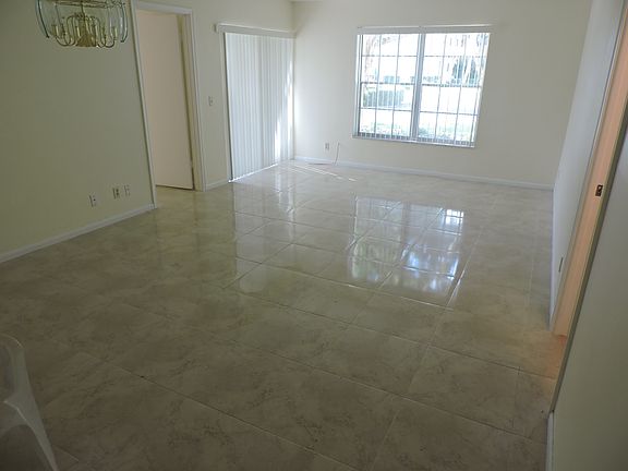 living room with whole condo tiled