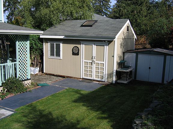 Large shed has power & sky light &  tool shed