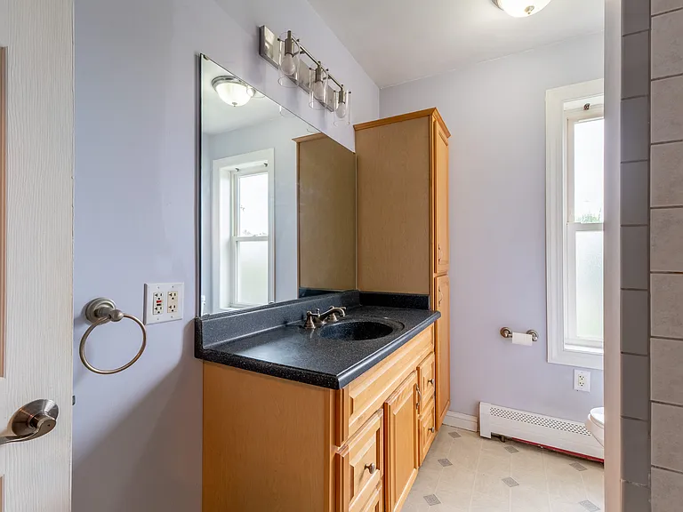 Bathroom is located between office/extra bedroom and kitchen