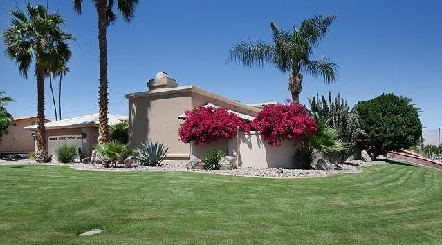 Front view of the home located on a corner lot