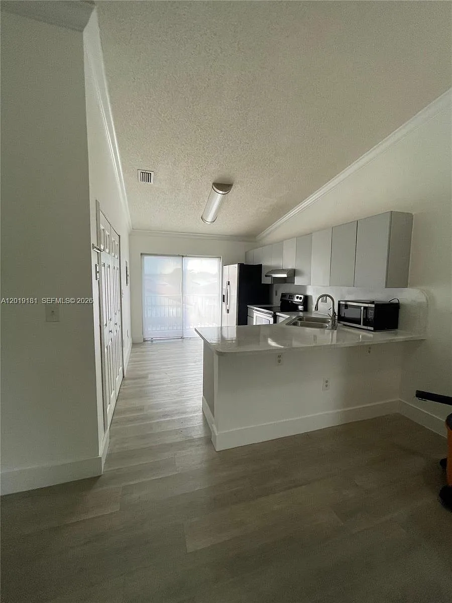 Building Photo - 3375 W 76th St #211