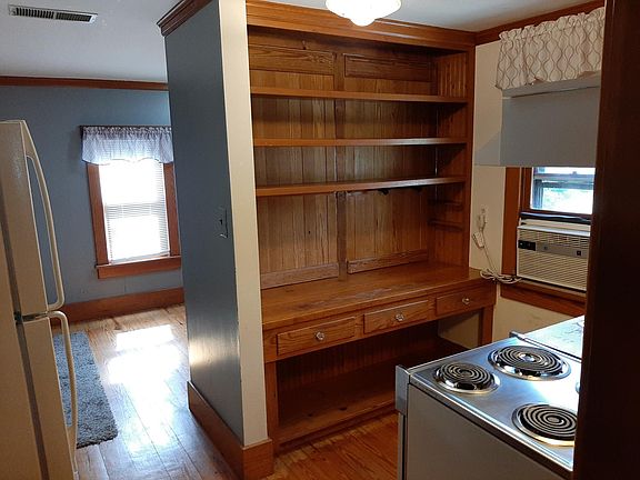 Kitchen (view 2) with two appliances and cupboards