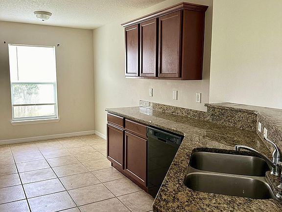Eat In Kitchen features granite, pantry and breakfast bar