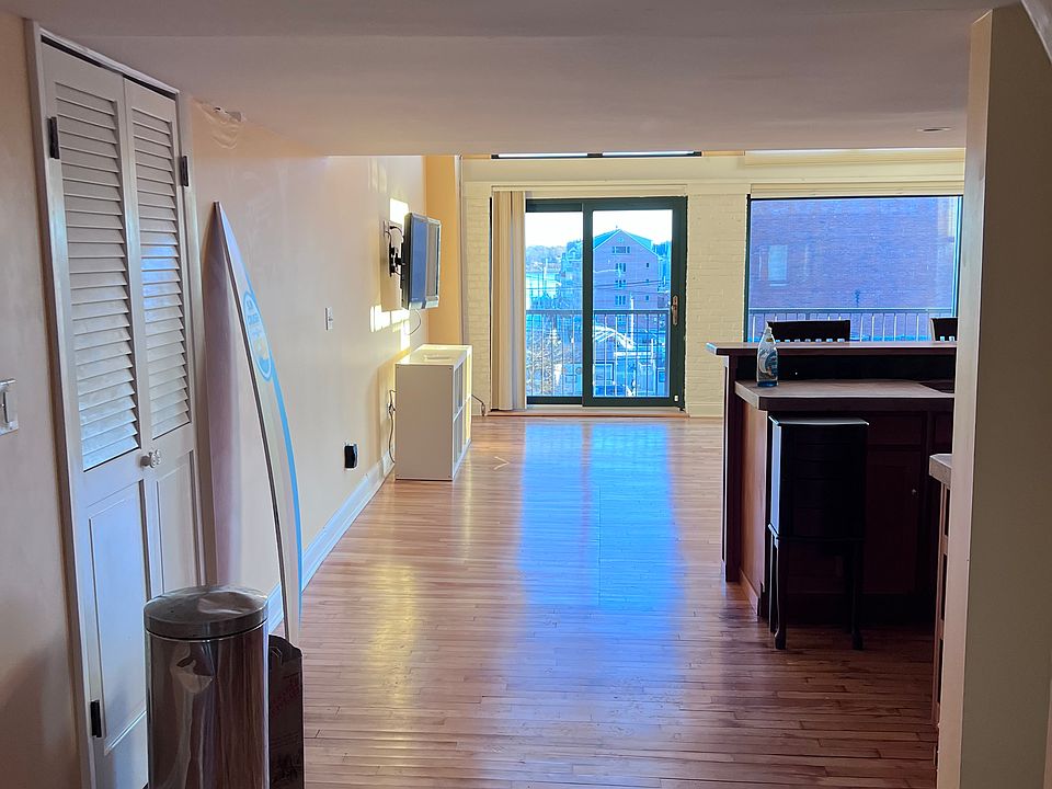 View upon entering apartment. Stairs to upstairs bedroom on right, just before kitchen.