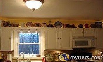 Cabinets with under/over the cabinet lighting & tile backsplash