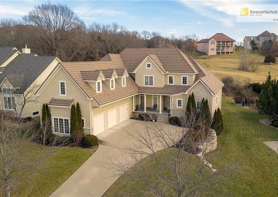 Stunning 1.5 Story with massive green space behind the home!