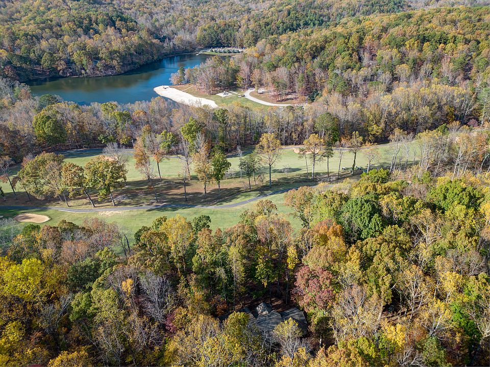 Aerial view of the home and it's location to the fairway and Lake