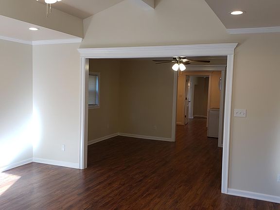 Cathedral ceiling in open living room .