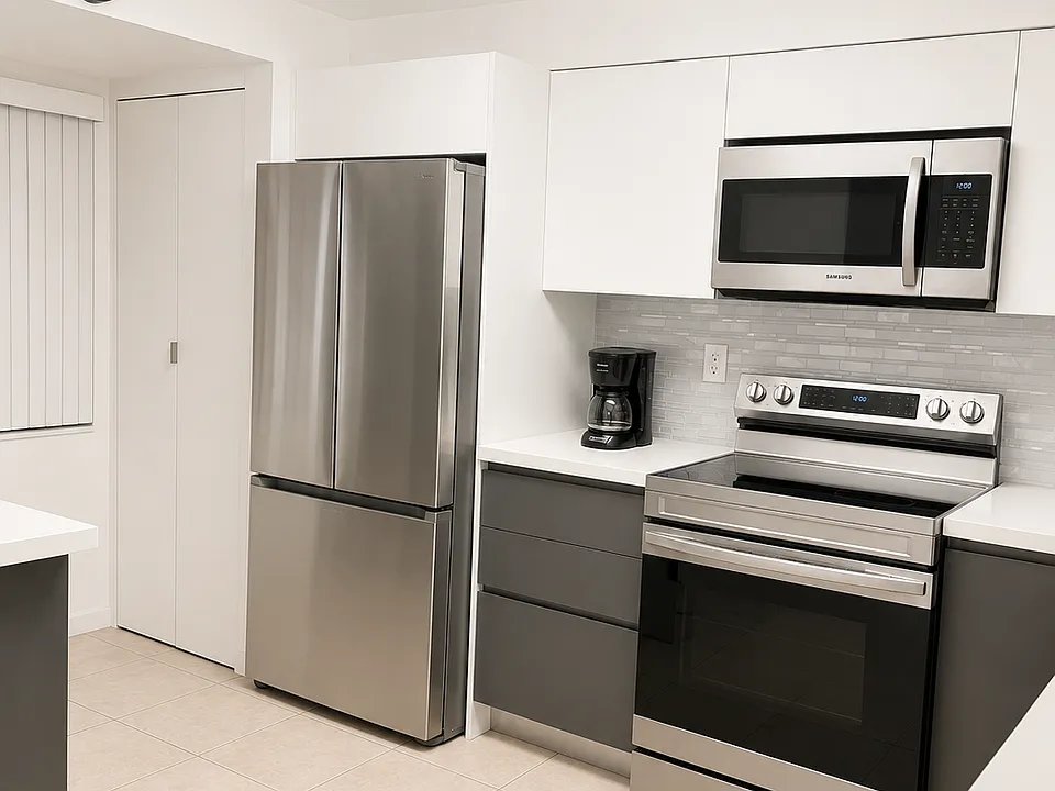 Refrigerator: Modern French-door refrigerator with separate freezer compartment.